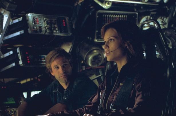 Aaron Eckhart,Hilary Swank